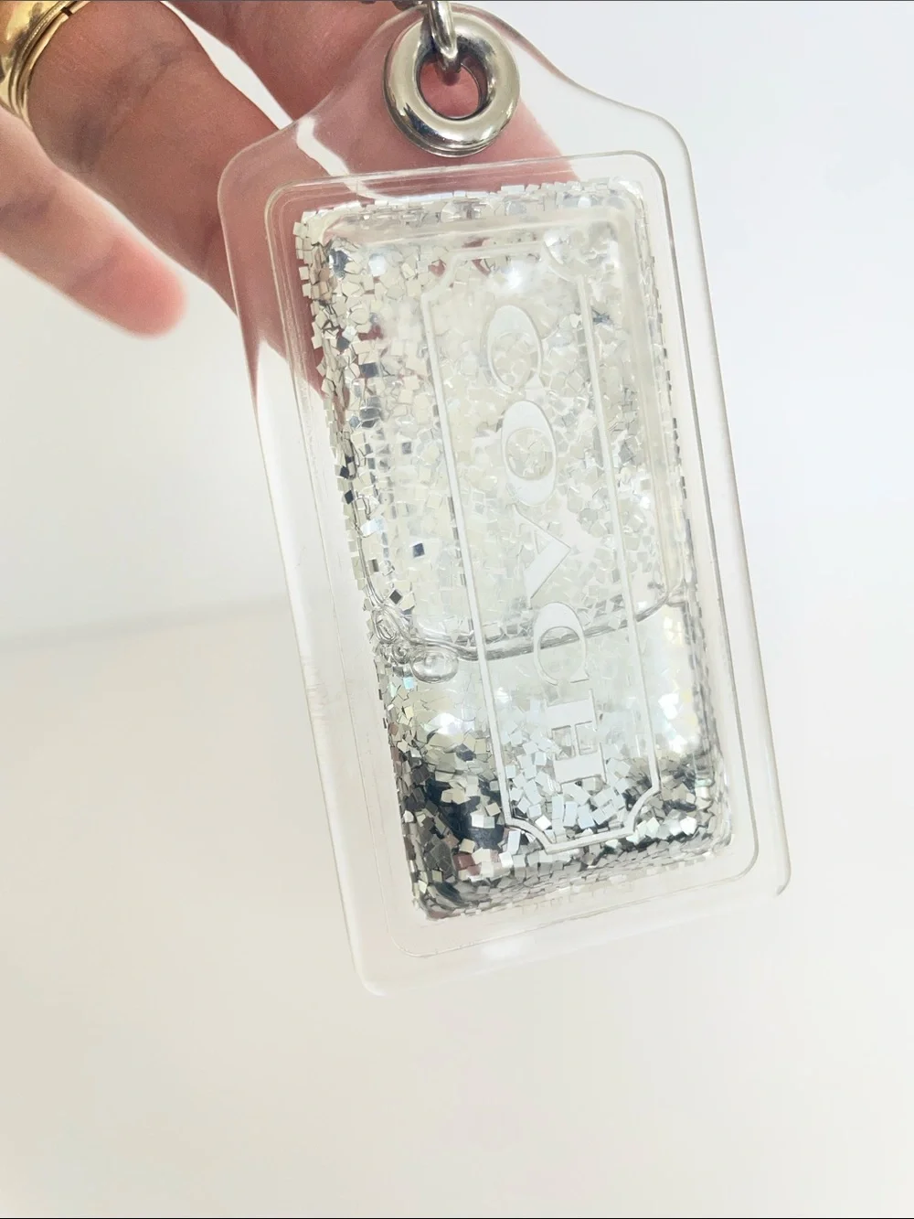 Coach Liquid Glitter Acrylic Hang Tag Clear | Silver